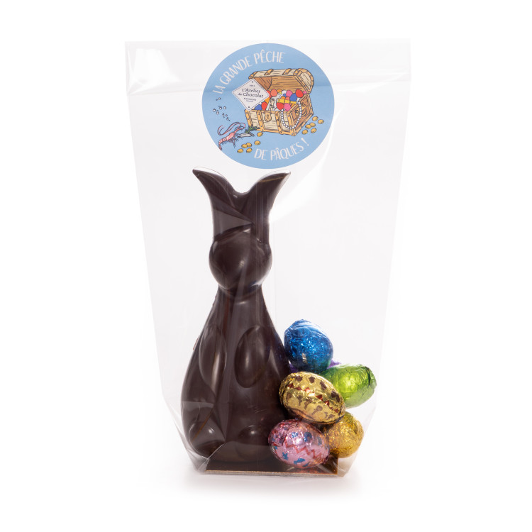 Lapin en chocolat de Pâques et ses petits oeufs enveloppés